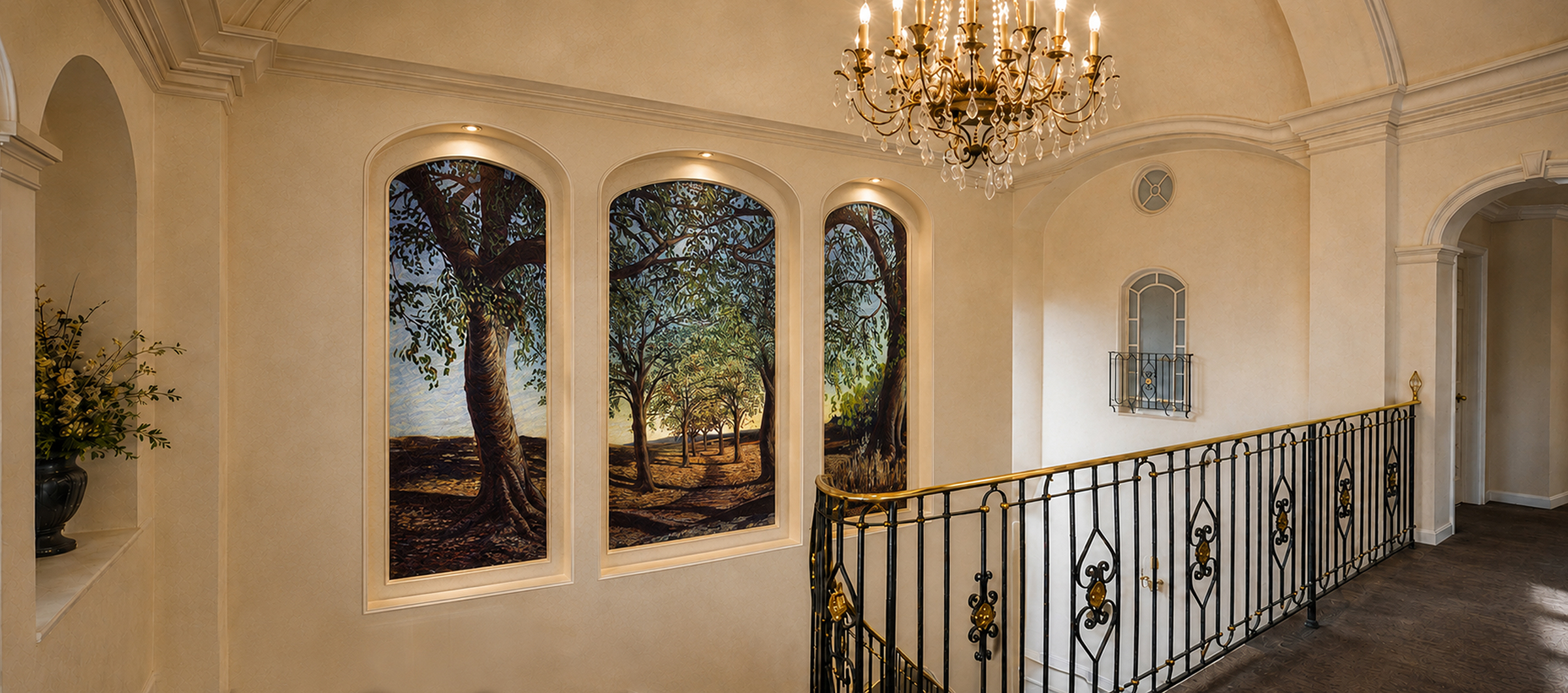 Sunlit orchard mural triptych installed across the upper staircase landing of a Toronto residence