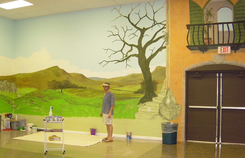 Paul Cavilla installing environmental murals at Ideal Elementary School in 2003